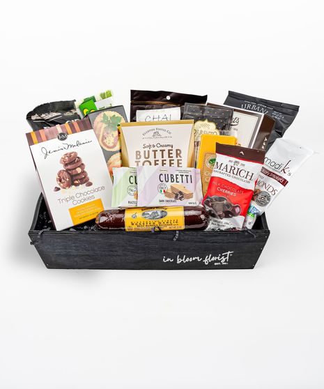 Your choice of wine, a variety of cocktail mixers, a pair of Sugarfina candy and chocolates, and a wine opener set.