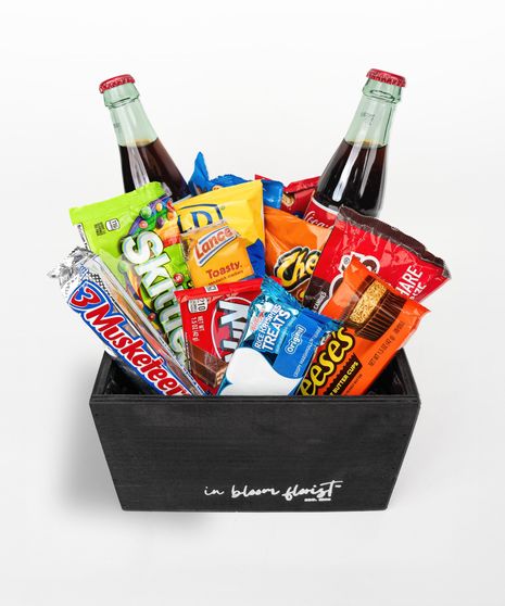 Your choice of wine, a variety of cocktail mixers, a pair of Sugarfina candy and chocolates, and a wine opener set.
