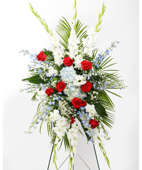 Incorporating colors of the American flag, this arrangement is sure to honor the brave soldier who fought for freedom and those who have a deep affection for our country.