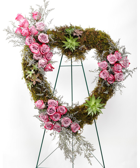 A wonderful array of pink flowers, succulents, and greenery is a lovely way to pay tribute to someone who will always be with you in your heart.
