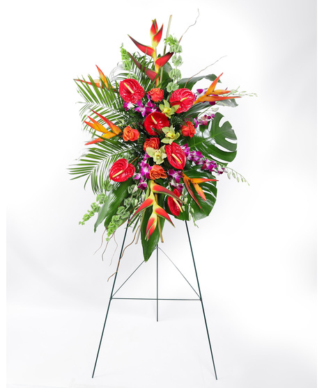Tropical florals are balanced with lush greenery to offer hope and encourage reflection. The Sunset Solace Standing Spray is vivid and expresses a deep and generous tribute.