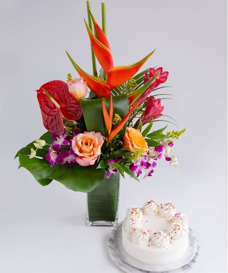 A vibrant tropical floral arrangement paired with a 6