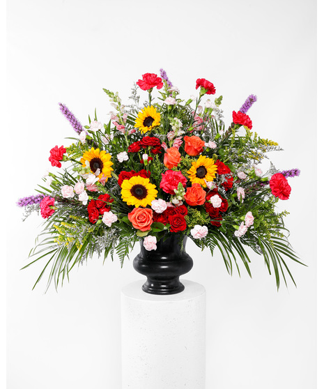 A stylish tribute of brilliant flowers ideal for the funeral home, service, or home. 