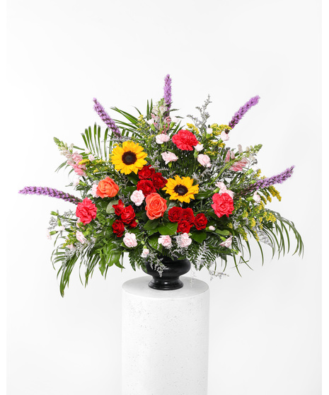 A stylish tribute of brilliant flowers ideal for the funeral home, service, or home. 