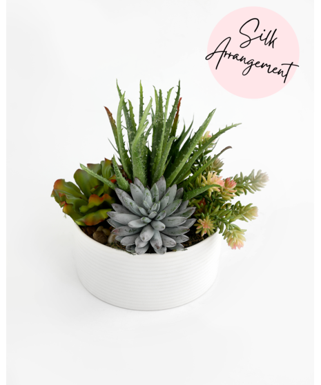 This handcrafted silk succulent garden is designed to be enjoyed as a forever gift or decor piece in the home.