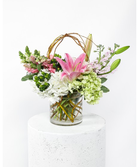 This arrangement is a delicate display of pink flowers that beautifully deliver a sincere expression of love and sympathy. 
