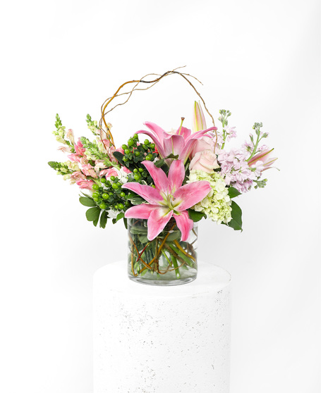 This arrangement is a delicate display of pink flowers that beautifully deliver a sincere expression of love and sympathy. 