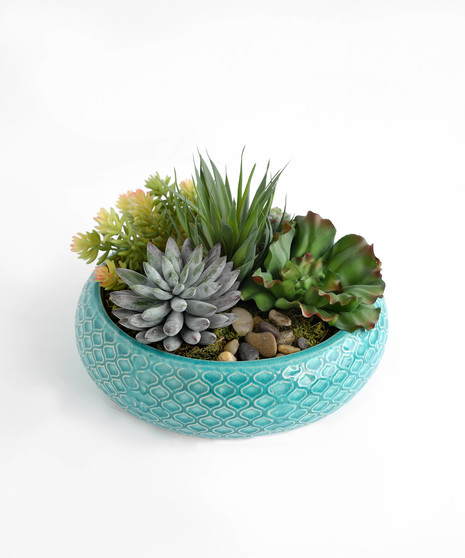 This handcrafted silk succulent garden is designed to be enjoyed as a forever gift or decor piece in the home.