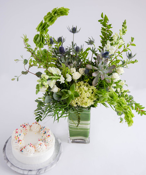 A garden-inspired succulent floral arrangement paired with a 6