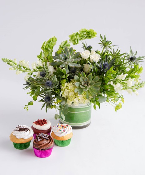 A garden-inspired greenery and succulent floral arrangement paired with a 4 pack of delicious, made-from-scratch cupcakes. 