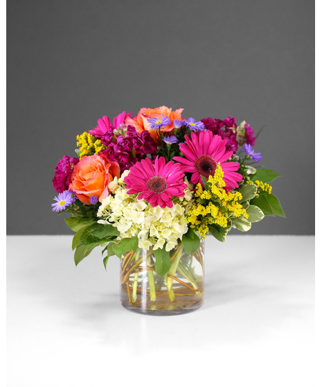 old and fearless, this arrangement features vibrant colors like hot pink, commanding attention with every petal. 